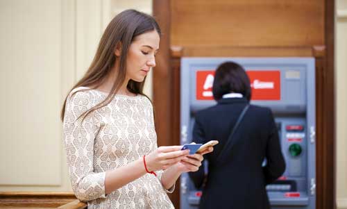 Women using a banking app on her mobile phone