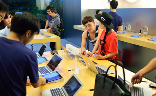 Customers in an Apple store