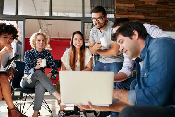 Man with laptop at meeting