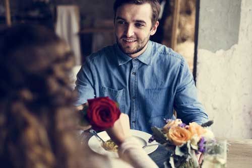 man giving Valentine's Day rose