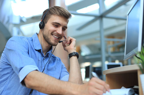 Customer Service Manager writing notes