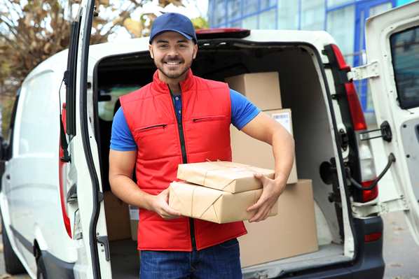 Delivery man handing over parcels