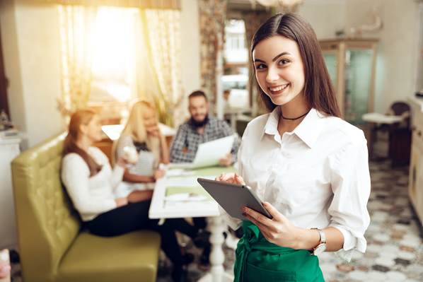 Waitress taking order on tablet