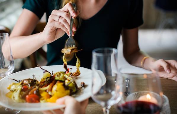 Women eating food in new restaurant