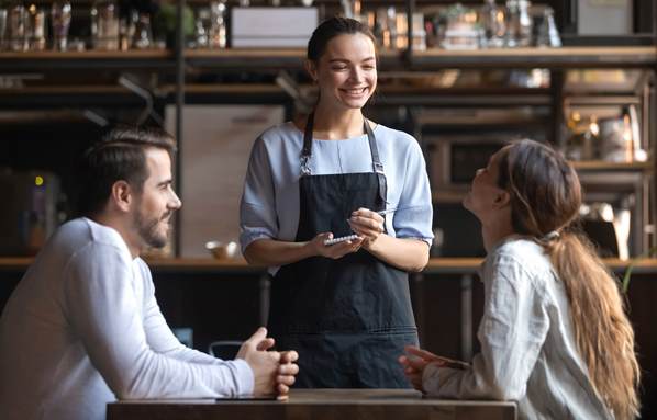 Waitress listening to customers