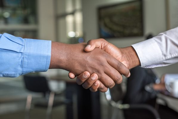 Job candidate shaking hands with recruiter px