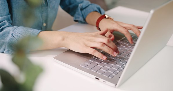 Women using laptop in cafe