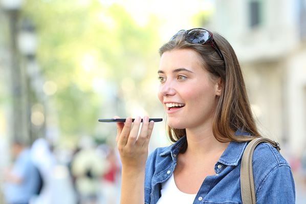 Girl using voice recognition on phone