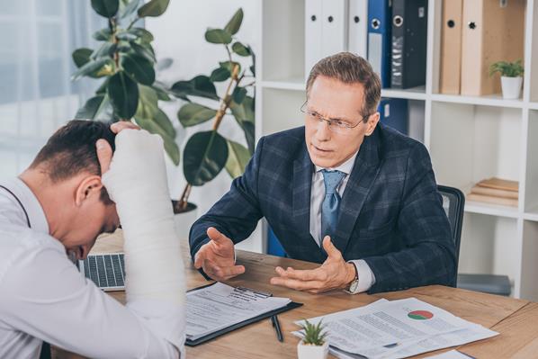 Injured employee talking to manager