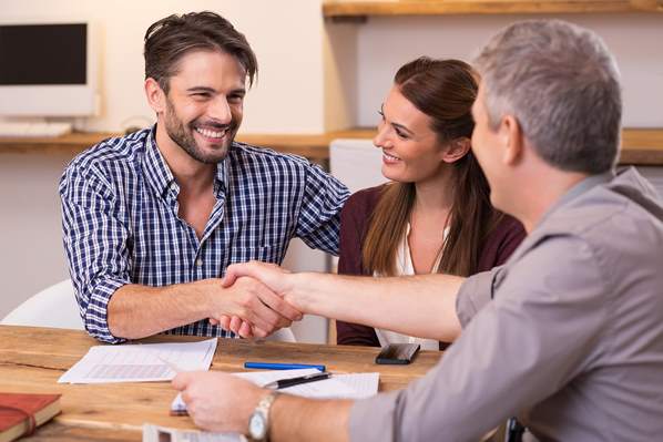 Young couple meeting with a financial advisor