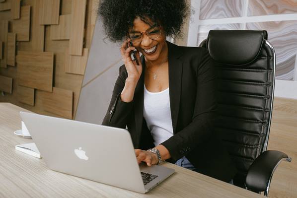 Office worker at desk with laptop