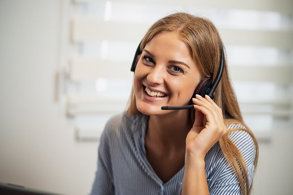 Receptionist taking phone calls from clients