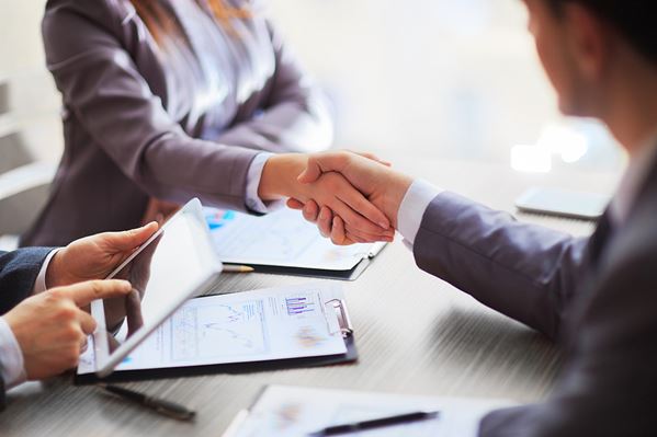 Lender shaking hands with client