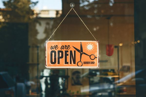 Open sign in hair salon doorway