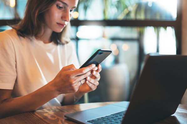 Business Director looking at phone