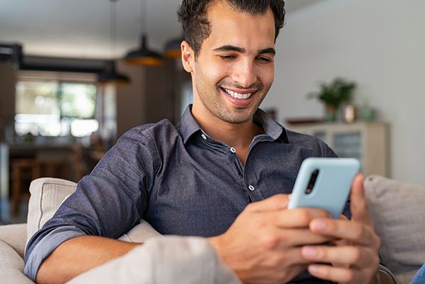 Businessman receiving text message