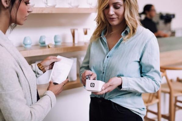 Customer making purchase in store