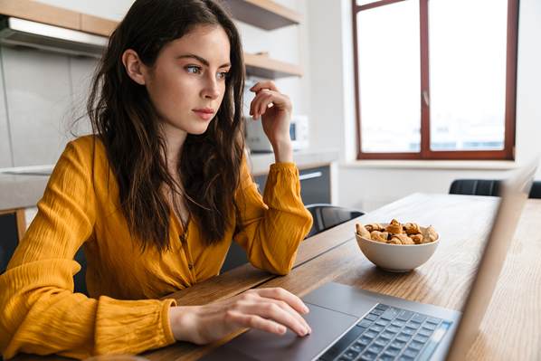 Customer checking delivery status on laptop