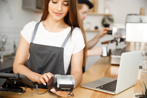 Paying the bill in a cafe