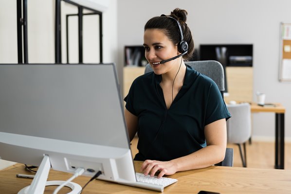 Call center agent talking to customer using headset
