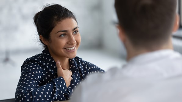 Manager talking to customer