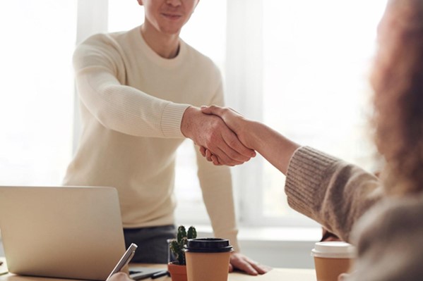 Candidate shaking hands with interviewer