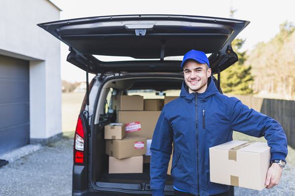 Delivery man holding parcel