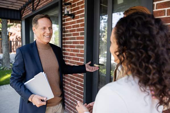 Realtor showing a customer a property