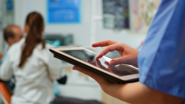 Healthcare professional using tablet
