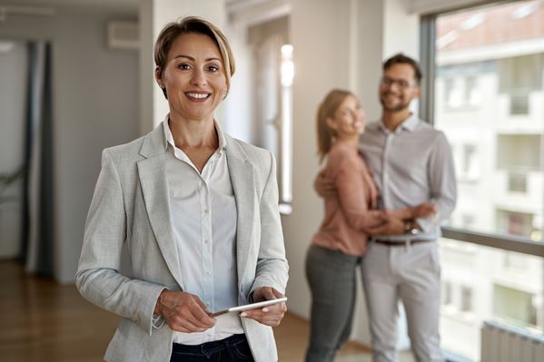 Real estate agent with happy customers