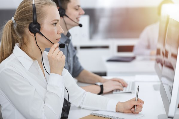 Call center employees on the telephone