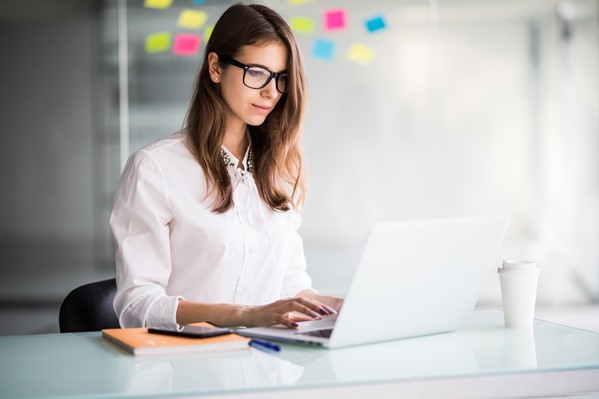 Customer Experience Manager working on computer