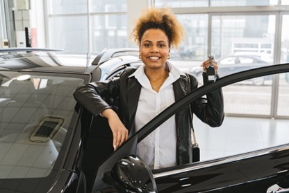 Salesperson opening car door