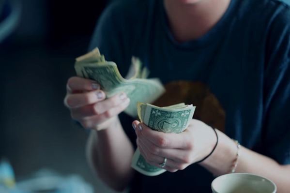 Person counting money