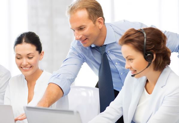 Manager working with customer service representatives