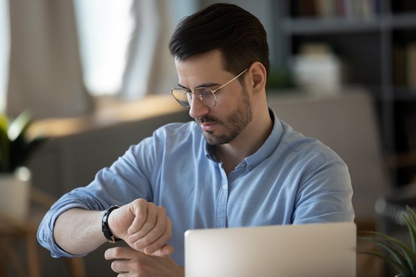 Office worker looking at his watch