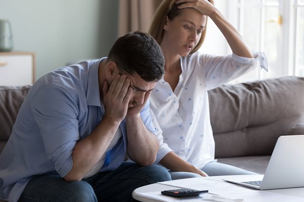 Man and women worried about their energy bills