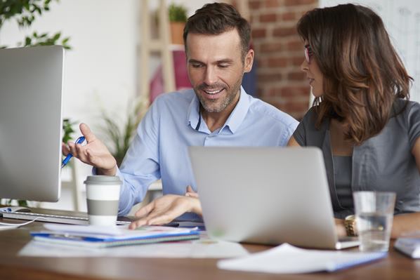 Office managers using learning management system.