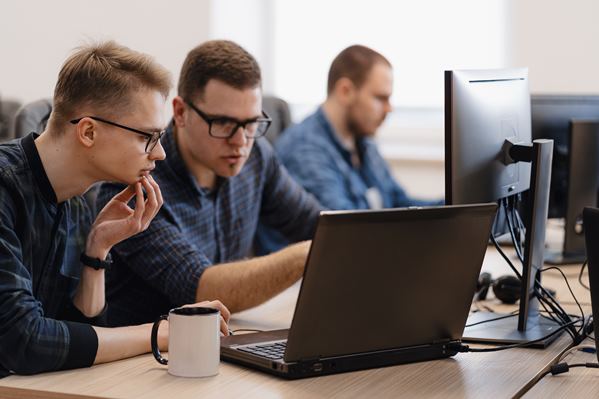 Marketing team looking at new software before launch