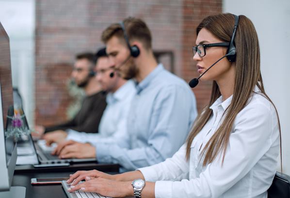 Customer care team using headsets in contact center