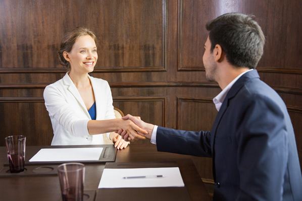 Lawyer shaking hands with client