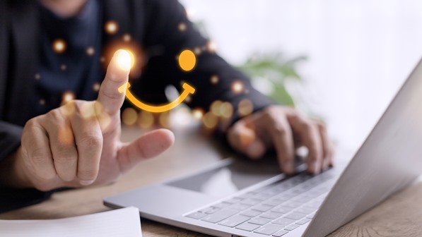 Employee processing customer complaints on his computer