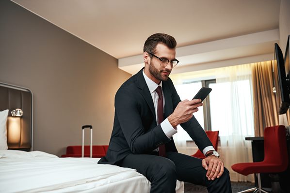 Guest using hotel app in room