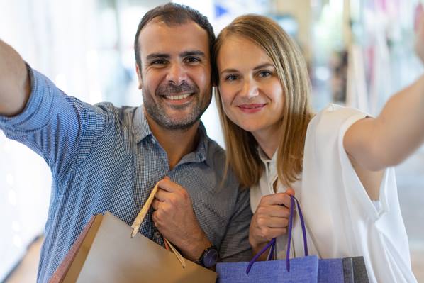 Happy customers with shopping bags