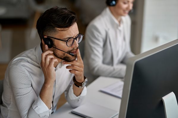 Contact centre assistant listening to a call from a customer