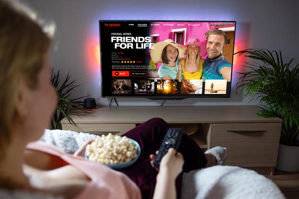Women watching streaming media on TV