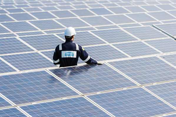 Engineer inspecting solar panels