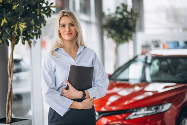 Car sales manager in showroom