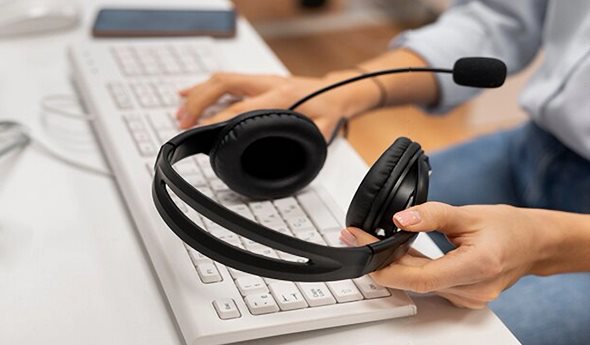 Help desk agent with headphones
