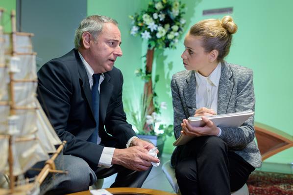 Funeral Director talking to bereaved man